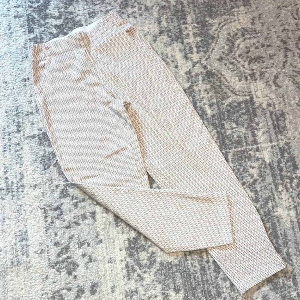 Max Studio Size Small pull on elastic waist pants. Tan and white print all over